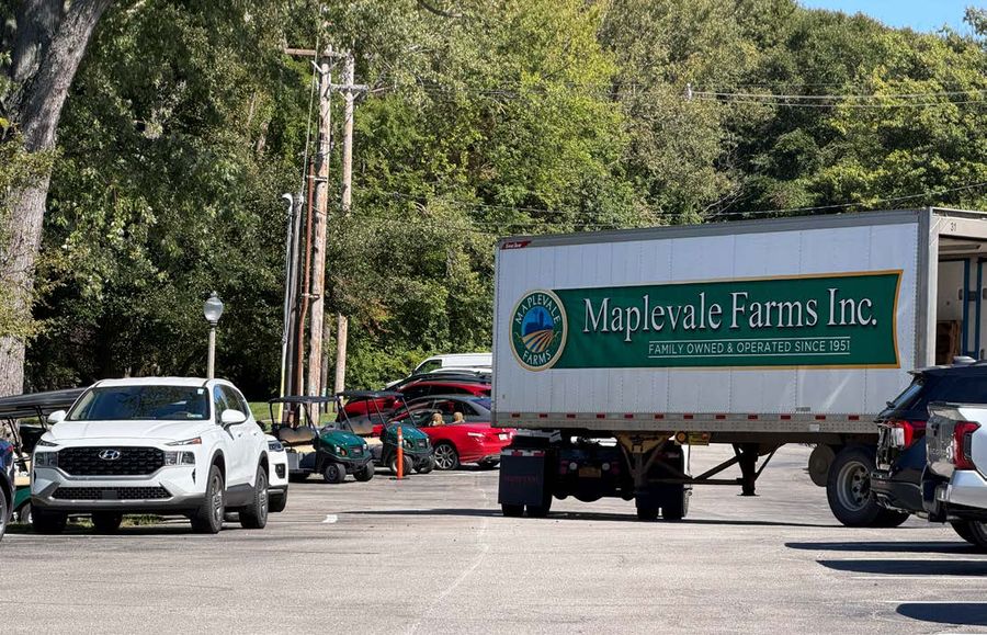 Delivery truck parked in view of the arrival drive