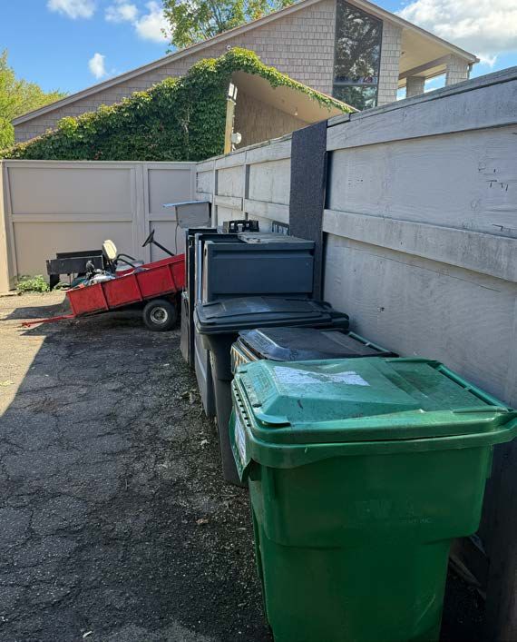 Trash and service area near the entrance