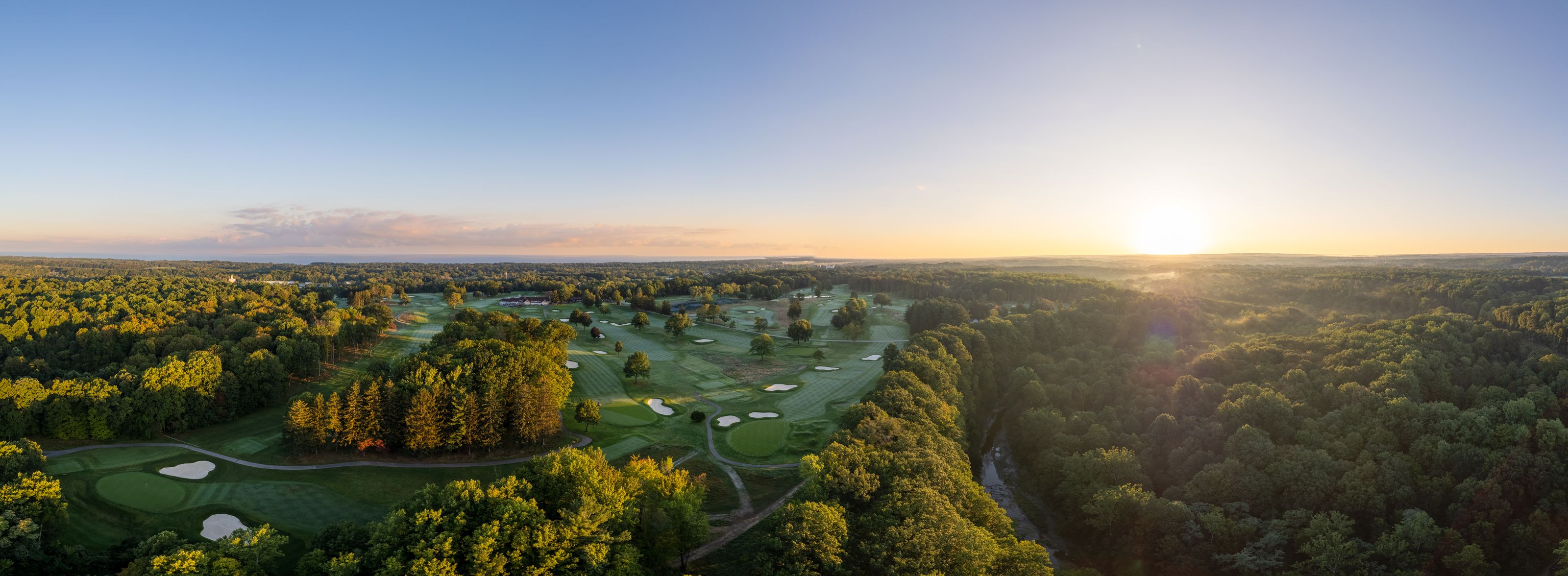 Sunrise over the Kahkwa Club golf course from above