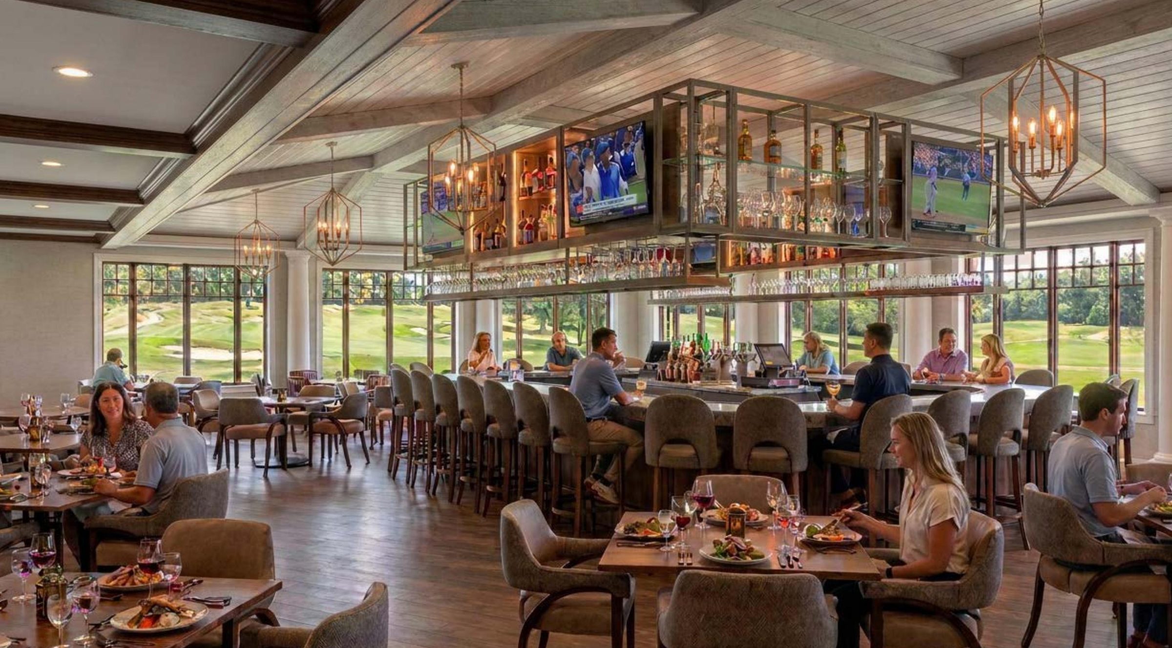 Concept image of the Sunset Grill with a central bar and course views